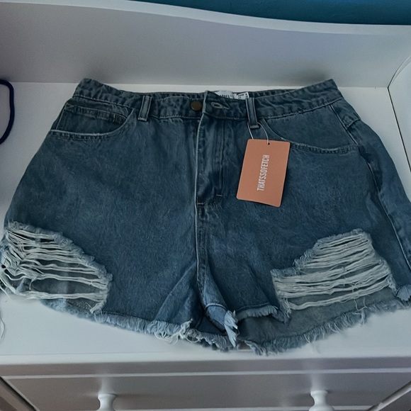 Blue distressed Jean shorts. - Picture 2 of 5